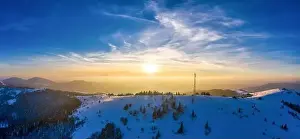 Hight Prints: Flying over radio tower in mountains, snow covered winter landscape