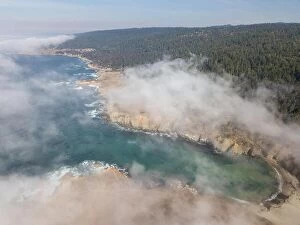 Aerial Landscape Collection: Fog begins to drift over the scenic northern California coastline in Sonoma