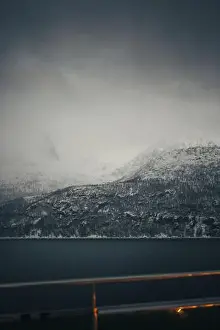 Brim Prints: Foggy clouds over snowy Lyngen Alps mountains in the arctic