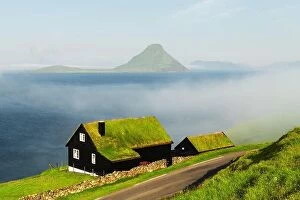 Images Dated 29th July 2019: Foggy morning view of a house with typical turf-top grass roof in the Velbastadur village