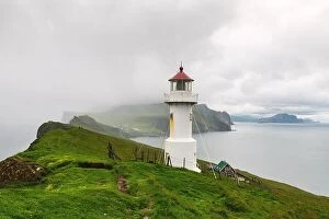 Images Dated 5th August 2019: Foggy view of old lighthouse on the Mykines island, Faroe islands, Denmark. Landscape photography