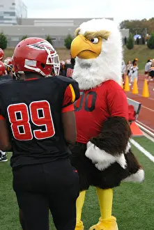 Maryland Prints: football player and school mascot talking at a high school football game in Huntington