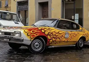 Hades Prints: A Ford Capri, customised in flaming red and yellow and with rooftop devil's horns