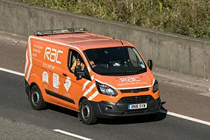 Distress Prints: A Ford Transit RAC vehicle breakdown recovery truck traveling northbound on the M6 motorway near Garstang in Lancashire