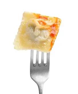 Fork Prints: Fork with tasty ravioli isolated on white