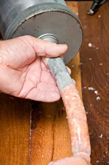 Flesh Prints: Forming sausages by filling intestines with spicy minced meat