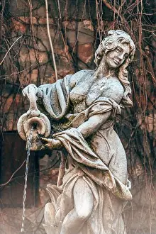 Art White Prints: Fountain statue of woman pouring water, selective focus