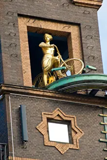 Danish Culture Prints: Fragment of building and statue of woman with bicycle in Copenhagen, Denmark
