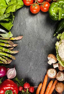 Tips Prints: Frame or border of assorted farm fresh vegetables on slate with copyspace including carrots