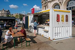 Medium Group Of People Prints: France, Paris, Gare de Lyon railway station, the square, container snacking