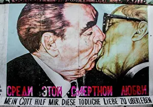 Kiss Prints: Fraternal kiss between Brezhnev and Honecker in East Side Gallery, Berlin