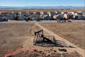 Subdivision Prints: Frederick, Colorado - An oil well near a housing subdivision on Colorado's front range
