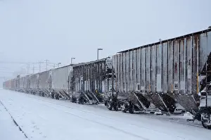 Pulling Prints: Freight train moves through snow storm in upstate New York, US