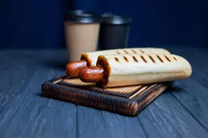 Hot Dog Prints: french hot dog in a roll with ketchup sauce with a coffee drink in a glass