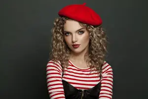 Hairdo Prints: French woman dressed in striped t-shirt and red beret on black background