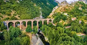 Building Stone Prints: Fresh green view from flying drone of ancient bridge across the Devil's Throat Gorge
