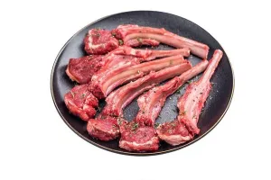 Lamb Prints: Fresh mutton chops, raw lamb meat cutlets on a plate isolated on white background
