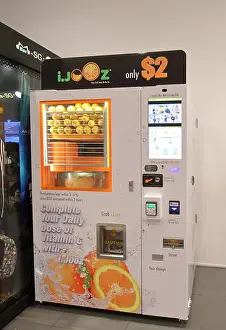 Singaporean Prints: Fresh orange squeeze juice vending machine in Singapore