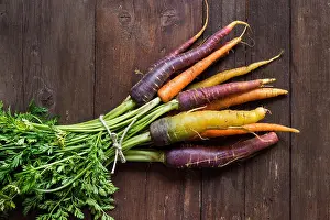 Burlap Prints: Fresh organic rainbow carrots with leaves on a wooden table