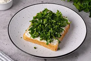 Cream Cheese Prints: Freshly cut herbs on a slice of bread with cream cheese