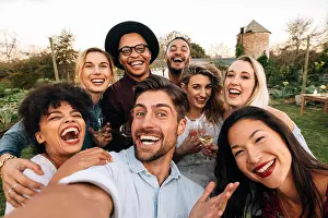 Millennials Prints: Friends chilling outside taking group selfie and smiling