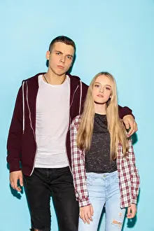 Rebel Prints: We are friends. Close up fashion portrait of two young cool hipster girl and boy wearing jeans wear