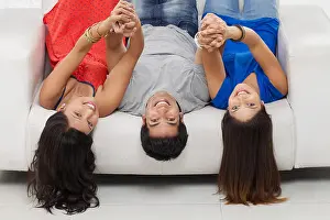 Lying Down Prints: Friends lying upside down on sofa