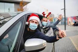 30 34 Years Prints: Friends wearing a protective face mask in the car. Holidays during epidemic