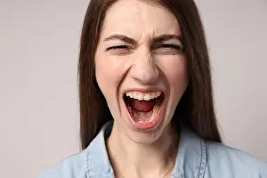 Panic Prints: Frustrated woman screaming on light grey background
