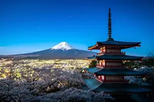 Fujiyoshida, Japan at Chureito Pagoda and Mt. Fuji in the spring with cherry blossoms full bloom during twilight. Japan Landscape and nature travel, o