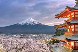 Images Dated 18th April 2017: Fujiyoshida, Japan view of Mt. Fuji and pagoda in spring season with cherry blossoms at dusk