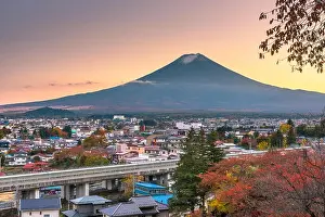 Fujiyoshida, Yamanashi, Japan town skyline in autumn at dusk with Mt. Fuji