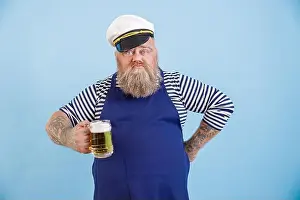 Booze Prints: Funny plus size man in sailor suit holds glass of foamy beer on light blue background
