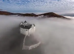 High Hill Prints: Fuzer, Hungary - Aerial view of the beautiful Castle of Fuzer standing out of the fog on an autumn morning with Zemplen