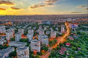 Galati, ROMANIA - July 22, 2021: Aerial view of Galati City, Romania. Night city lights after sunset at blue hour