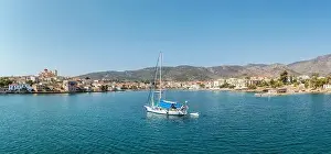 Delphi Prints: Galaxidi Greece, sunny day. Sailboat anchored on calm sea