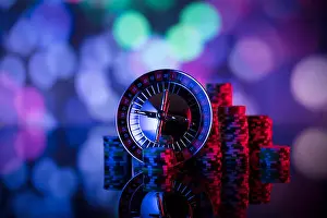 Spinning Prints: Gambling games theme. Roulette and poker chips on colorful bokeh background