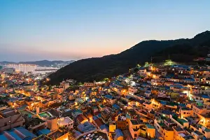 Gamcheon Culture Village formed by houses built in staircase-fashion on the foothills of a coastal mountain at night in Busan, South Korea