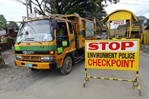Dump Prints: Garbage trucks at the entrance to Payatas garbage landfill