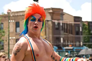 Make Up Prints: Gay man wearing a colorful wig in a Gay Pride Parade