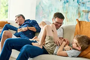 Tickling Prints: Gay parents, family and tickling in living room with dads and kids together with laugh