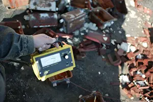 Accidents Prints: A Geiger Counter showing high levels of radiation On the ground action training for Greenpeace Radiation Safety
