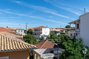 Hellenic Prints: A general view of a Greek island village showing old and renovated buildings