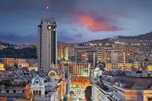 Genoa, Italy cityscape at dusk over Brigata Liguria Street
