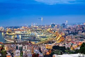 Ligurian Prints: GENOA, ITALY - DECEMBER 31, 2021: Ferries and cargo ships wait in the Port of Genoa at dusk