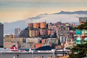 Images Dated 29th December 2021: Genova, Italy cityscape wity misty mountains