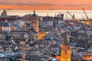 Genova, Italy downtown skyline with historic towers at dusk