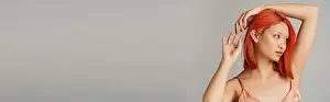 Red Hair Prints: gentle young asian woman with perfect skin posing in silk slip dress on grey backdrop