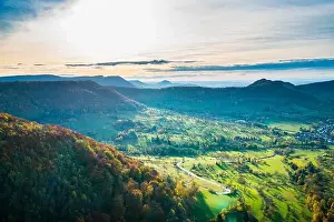 Germany, Panorama view above swabian alb nature landscape at neuffen village in colorful autumn atmosphere at sunset