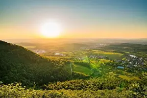 Germany, Sunset atmosphere over endless mountains and green landscape of swabian alb nature scenery